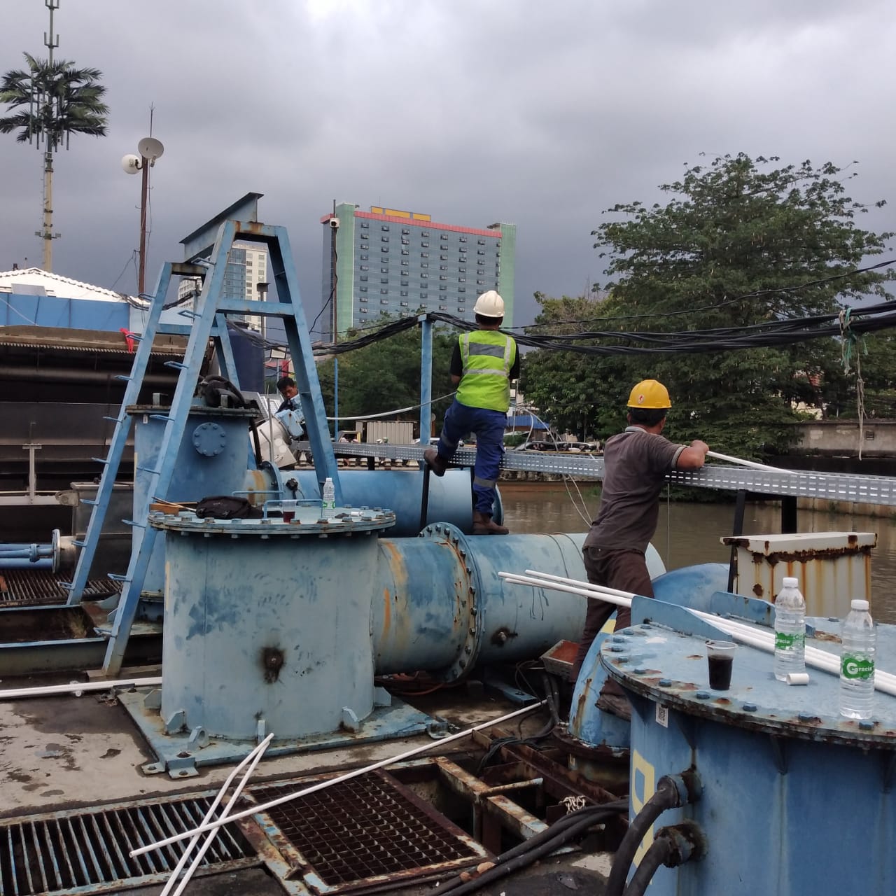 Cable tray installation beside river at Setiabudi pump area